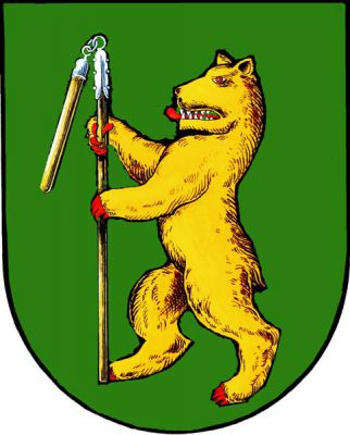 V zeleném štítě zlatý medvěd s červenou zbrojí držící cep přirozených barev se stříbrným kováním. Znak Praha-Nedvězí