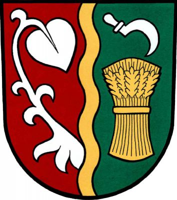V červeno-zeleně zlatým zúženým vlnitým kůlem polceném štítě vpravo z kůlu vyrůstající stříbrné lekno, vlevo zlatý obilný snop převýšený kosmo dolů položeným stříbrným srpem. Znak Slatina nad Zdobnicí