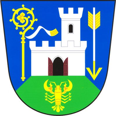 V modrém štítě na zeleném návrší se zlatým rakem volná stříbrná hradba s cimbuřím, černou gotickou branou s otevřenými dřevěnými vraty přirozené barvy a vlevo vynikající stříbrnou věží s cimbuřím s černým obloukovým oknem. Vpravo zlatá berla s doleva vlajícím stříbrným sudariem, vlevo postavený stříbrný šíp se zlatým hrotem a opeřením. Znak Újezd u Tišnova