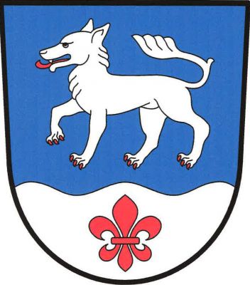 V modrém štítě kráčející stříbrný vlk s červenou zbrojí nad stříbrnou vlnitou patou s červenou lilií. Znak Vlčeves